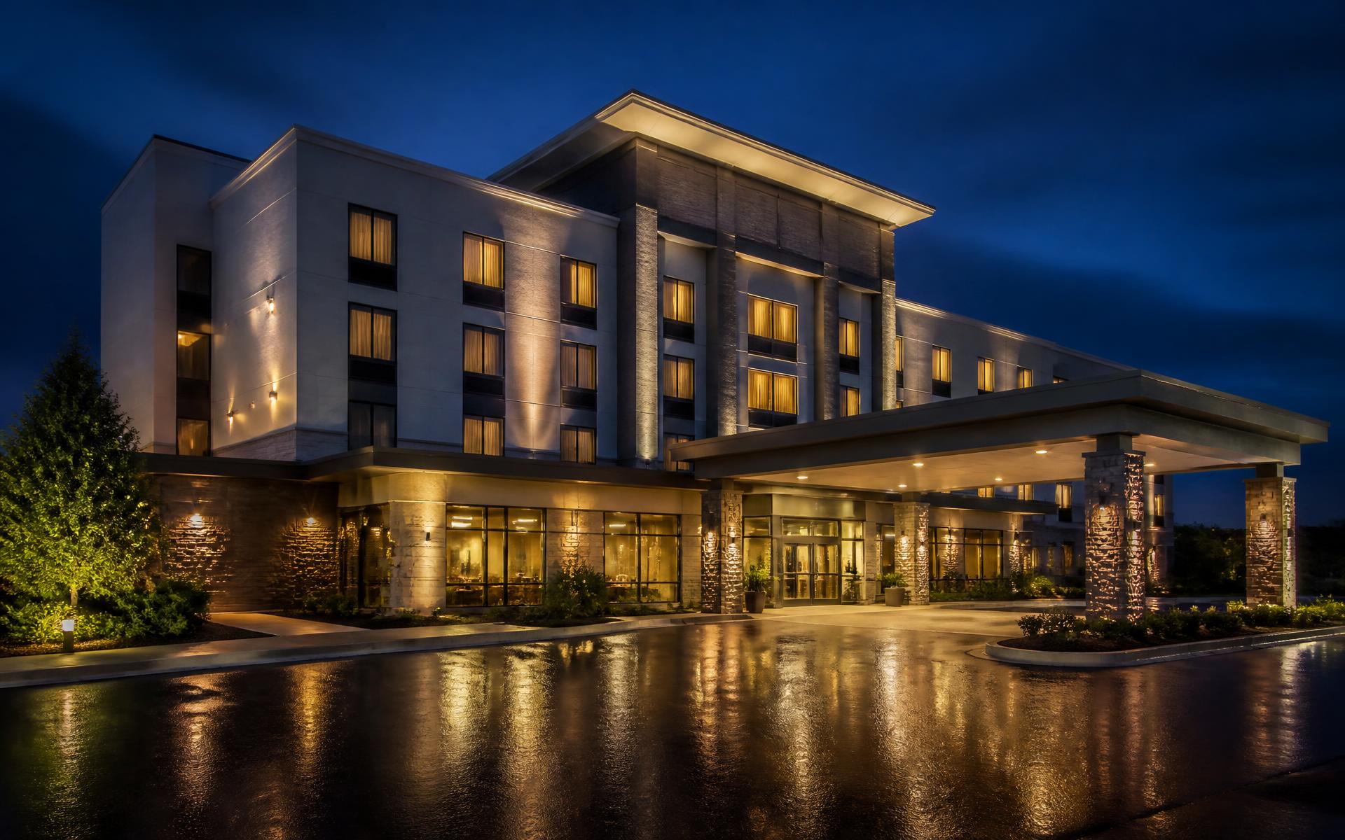 Hotel exterior at dusk renovated by CAA Renovations